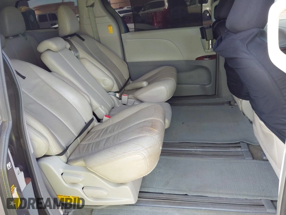 2014 Toyota Sienna XLE with VIN 5TDYK3DC2ES438980, listed as a IAAI auction lot 42067750 with 143,728 mi miles and . Bid and sale history available at DreamBid. Image 8.