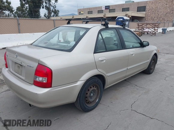 2000 Mazda Protege DX with VIN JM1BJ2223Y0212144, listed as a IAAI auction lot 41570436 with 221,430 mi miles and . Bid and sale history available at DreamBid. Image 4.