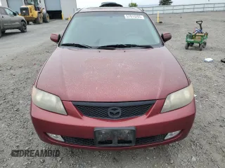 2002 Mazda Protege DX z VIN JM1BJ225320636991, wystawiony jako Copart lot #57915265 z przebiegiem 123 371 mil mil oraz Szkoda całkowita • Salvage title. Historia ofert i sprzedaży dostępna na DreamBid. Obrazek 5.
