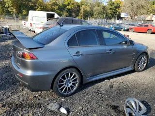 2014 Mitsubishi Lancer Evolution GSR z VIN JA32W8FV6EU018171, wystawiony jako Copart lot #77109934 z przebiegiem 83 467 mil mil oraz Tytuł czysty. Historia ofert i sprzedaży dostępna na DreamBid. Obrazek 3.