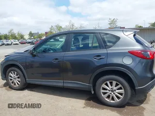 2014 Mazda CX-5 Sport with VIN JM3KE2BE0E0411377, listed as a IAAI auction lot 42143229 with 137,384 mi miles and . Bid and sale history available at carsss.com. Image 14.