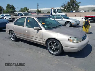 1998 Ford Contour LX z VIN 1FALP6538WK144977, wystawiony jako IAAI lot #42432087 z przebiegiem 141 439 mil mil oraz . Historia ofert i sprzedaży dostępna na DreamBid. Obrazek 1.