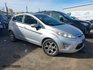 2011 Ford Fiesta SES with VIN 3FADP4FJ1BM149138, listed as a IAAI auction lot 41612288 with 131,798 mi miles. Bid and sale history available at carsss.com. Image 1.