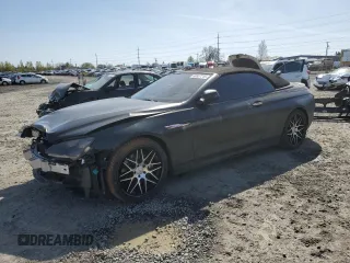 2012 BMW 6 Series 650i z VIN WBALZ3C52CDL72199, wystawiony jako Copart lot #50937715 z przebiegiem 55 513 mil mil oraz Szkody całkowita. Historia ofert i sprzedaży dostępna na DreamBid. Obrazek 1.