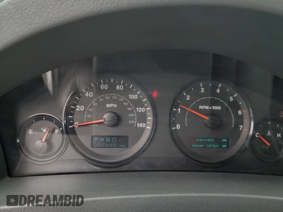 2005 Jeep Grand Cherokee Laredo with VIN 1J4GR48KX5C565762, listed as a Copart auction lot 63080115 with 122,349 mi miles and Salvage title. Bid and sale history available at DreamBid. Image 9.