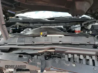 2023 GMC Sierra 3500HD AT4 z VIN 1GT49VEY3PF127108, wystawiony jako Copart lot #57052823 z przebiegiem 9915 mil mil oraz Szkody całkowita. Historia ofert i sprzedaży dostępna na DreamBid. Obrazek 11.