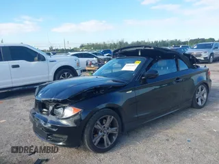 2011 BMW 1 Series 128i with VIN WBAUL7C54BVM80474, listed as a IAAI auction lot 42031032 with 76,617 mi miles and . Bid and sale history available at carsss.com. Image 2.