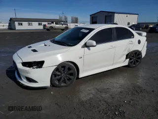 2014 Mitsubishi Lancer Ralliart with VIN JA32V6FV7EU015979, listed as a Copart auction lot 46497055 with 158,570 mi miles and Salvage Title. Bid and sale history available at DreamBid. Image 1.
