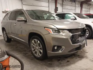 2018 Chevrolet Traverse Premier with VIN 1GNEVJKW0JJ165144, listed as a IAAI auction lot 41129951 with 137,593 mi miles. Bid and sale history available at carsss.com. Image 1.