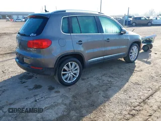 2012 Volkswagen Tiguan SEL with VIN WVGAV7AX2CW000962, listed as a IAAI auction lot 40815475 with 162,859 mi miles and . Bid and sale history available at DreamBid. Image 4.