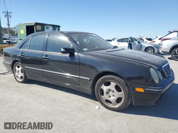 2000 Mercedes-Benz E-Class with VIN WDBJF70JXYB091085, listed as a Copart auction lot 77136484 with 185,429 mi miles and Salvage Title. Bid and sale history available at carsss.com. Image 4.