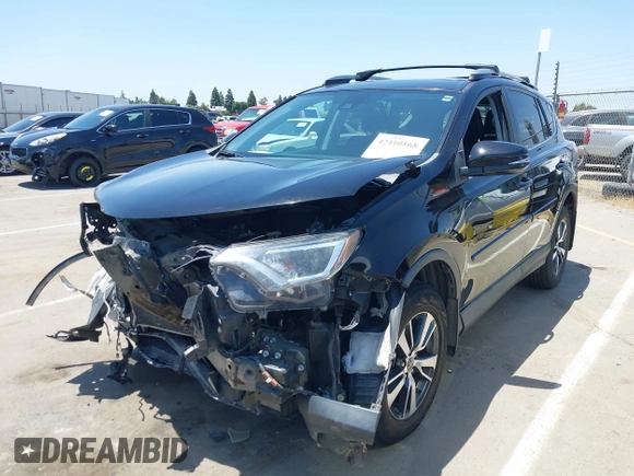 2018 Toyota RAV4 XLE with VIN 2T3WFREV2JW447623, listed as a IAAI auction lot 42410168 with 84,800 mi miles and . Bid and sale history available at DreamBid. Image 19.