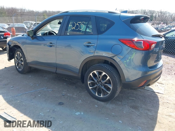 2016 Mazda CX-5 Grand Touring z VIN JM3KE4DY6G0785255, wystawiony jako IAAI lot #41887066 z przebiegiem 171 334 mil mil oraz . Historia ofert i sprzedaży dostępna na DreamBid. Obrazek 3.