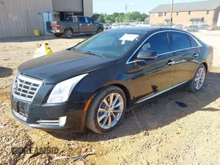 2014 Cadillac XTS Luxury z VIN 2G61M5S30E9229758, wystawiony jako IAAI lot #42179952 z przebiegiem 125 848 mil mil oraz . Historia ofert i sprzedaży dostępna na DreamBid. Obrazek 2.