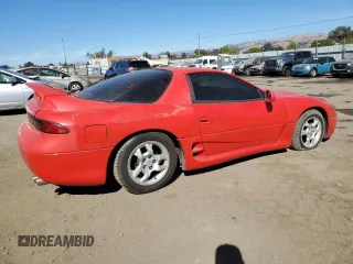 1999 Mitsubishi 3000GT z VIN JA3AM44H2XY001614, wystawiony jako Copart lot #77580444 z przebiegiem 128 948 mil mil oraz Tytuł czysty. Historia ofert i sprzedaży dostępna na DreamBid. Obrazek 3.