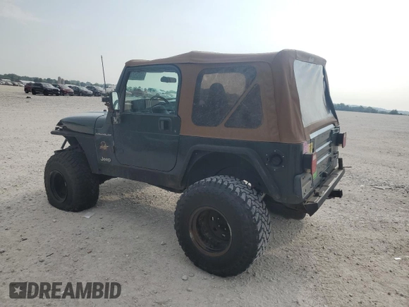 2002 Jeep Wrangler Sahara with VIN 1J4FA59S02P729015, listed as a Copart auction lot 63525745 with Not provided miles and Clean title. Bid and sale history available at DreamBid. Image 2.