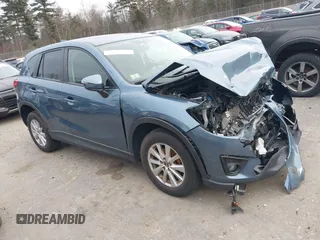 2015 Mazda CX-5 Touring with VIN JM3KE4CY1F0545305, listed as a IAAI auction lot 41234599 with 92,791 mi miles. Bid and sale history available at carsss.com. Image 1.