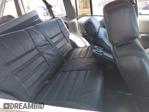 1991 Jeep Cherokee Country z VIN 1J4FJ78S7ML632675, wystawiony jako IAAI lot #42283175 z przebiegiem 116 062 mil mil oraz . Historia ofert i sprzedaży dostępna na DreamBid. Obrazek 8.