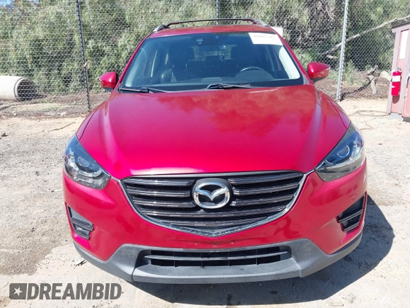 2016 Mazda CX-5 Grand Touring with VIN JM3KE2DY3G0686588, listed as a IAAI auction lot 41697312 with 65,090 mi miles. Bid and sale history available at carsss.com. Image 12.