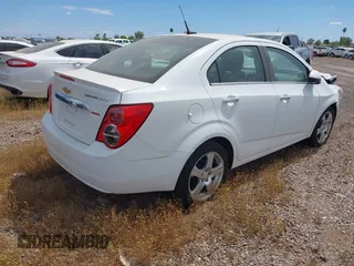 2014 Chevrolet Sonic LTZ with VIN 1G1JE5SB4E4227749, listed as a IAAI auction lot 38965556 with 69,550 mi miles. Bid and sale history available at carsss.com. Image 4.