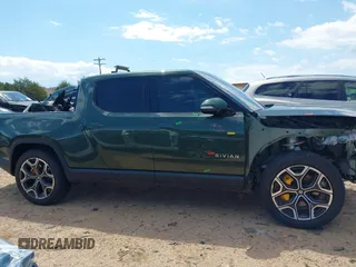 2023 Rivian R1T Adventure z VIN 7FCTGAAAXPN019894, wystawiony jako IAAI lot #42168226 z przebiegiem 23 380 mil mil oraz . Historia ofert i sprzedaży dostępna na DreamBid. Obrazek 14.