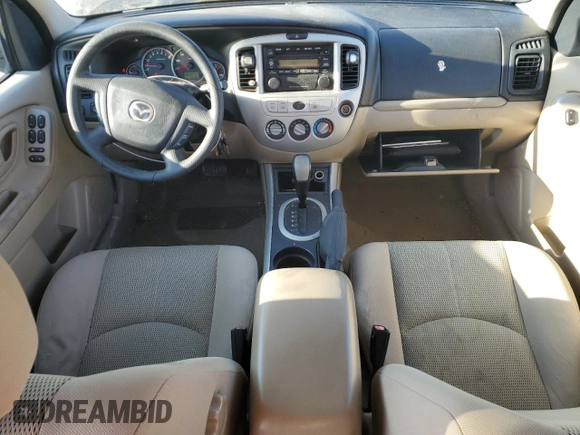 2006 Mazda Tribute S with VIN 4F2YZ04116KM23873, listed as a Copart auction lot 79926084 with 67,142 mi miles and Salvage Title. Bid and sale history available at DreamBid. Image 8.