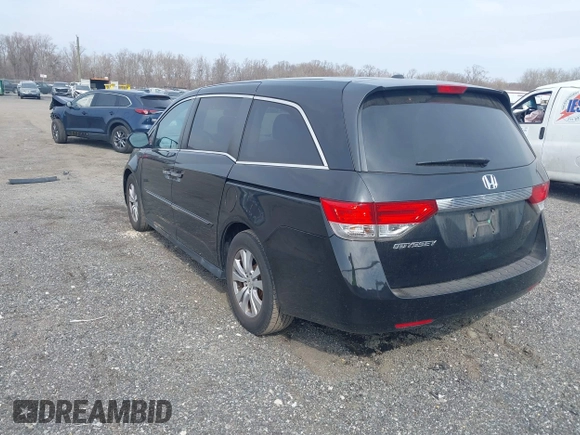 2017 Honda Odyssey EX-L with VIN 5FNRL5H65HB026014, listed as a IAAI auction lot 41719790 with 61,429 mi miles and . Bid and sale history available at DreamBid. Image 3.