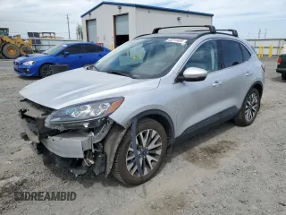 2020 Ford Escape Titanium with VIN 1FMCU9J99LUB07009, listed as a Copart auction lot 63213495 with 61,376 mi miles and Salvage title. Bid and sale history available at DreamBid. Image 1.