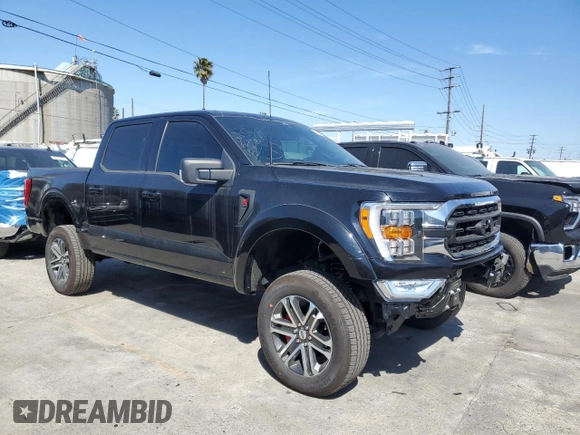 2021 Ford F-150 XL with VIN 1FTFW1E54MFD11453, listed as a Copart auction lot 50240015 with 8,645 mi miles and Salvage title. Bid and sale history available at DreamBid. Image 4.