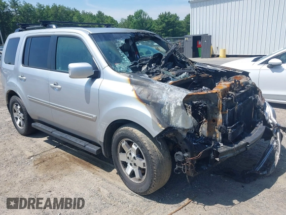 2010 Honda Pilot Touring z VIN 5FNYF4H94AB010058, wystawiony jako IAAI lot #42495313 z przebiegiem 157 306 mil mil oraz . Historia ofert i sprzedaży dostępna na DreamBid. Obrazek 1.