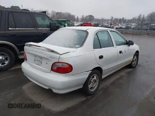 1999 Hyundai Accent z VIN KMHVF24N1XU583604, wystawiony jako IAAI lot #41613240 z przebiegiem 163 938 mil mil oraz . Historia ofert i sprzedaży dostępna na DreamBid. Obrazek 4.