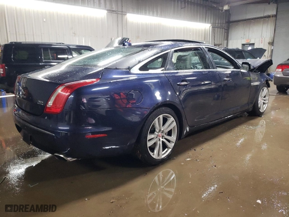 2014 Jaguar XJ with VIN SAJWJ2GD5E8V69562, listed as a Copart auction lot 87737195 with 100,525 mi miles and Salvage Title. Bid and sale history available at carsss.com. Image 3.