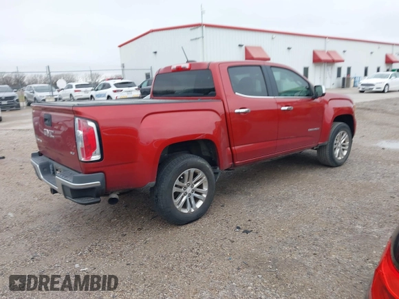 2015 GMC Canyon 2WD SLT with VIN 1GTG5CE3XF1211164, listed as a IAAI auction lot 41490387 with 163,932 mi miles. Bid and sale history available at carsss.com. Image 4.