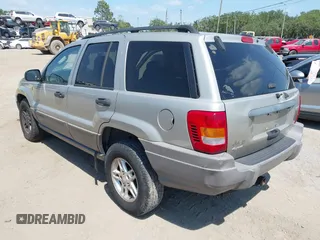 2004 Jeep Grand Cherokee Laredo z VIN 1J4GW48SX4C283922, wystawiony jako IAAI lot #42306869 z przebiegiem 263 812 mil mil oraz . Historia ofert i sprzedaży dostępna na DreamBid. Obrazek 3.