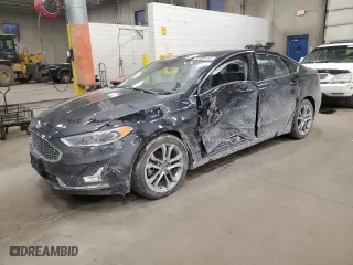 2020 Ford Fusion Hybrid Titanium with VIN 3FA6P0RU3LR233957, listed as a Copart auction lot 84908134 with 71,666 mi miles and Salvage Title. Bid and sale history available at carsss.com. Image 1.