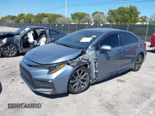 2021 Toyota Corolla SE with VIN JTDS4MCE1MJ063524, listed as a IAAI auction lot 41822622 with 50,882 mi miles. Bid and sale history available at carsss.com. Image 2.