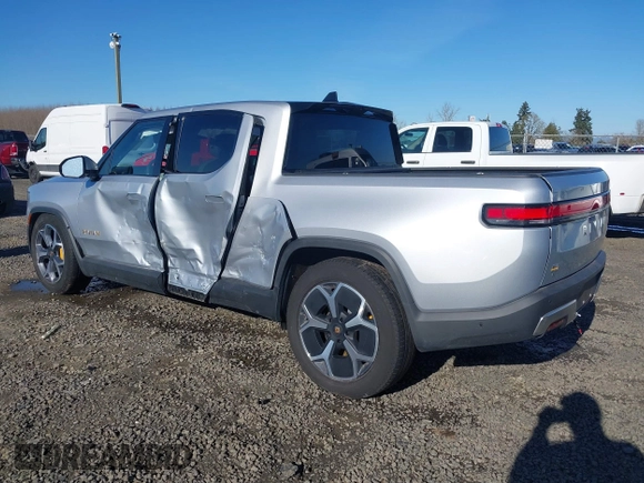 2023 Rivian R1T Adventure with VIN 7FCTGAAA0PN021864, listed as a IAAI auction lot 41620630 with 1 mi miles. Bid and sale history available at carsss.com. Image 3.