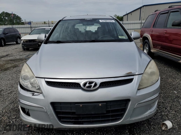 2009 Hyundai Elantra Touring z VIN KMHDC86E29U038194, wystawiony jako Copart lot #57483375 z przebiegiem 218 337 mil mil oraz Szkoda całkowita • Salvage title. Historia ofert i sprzedaży dostępna na DreamBid. Obrazek 5.