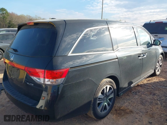 2014 Honda Odyssey Touring with VIN 5FNRL5H90EB077054, listed as a IAAI auction lot 41904456 with 197,869 mi miles and . Bid and sale history available at carsss.com. Image 4.