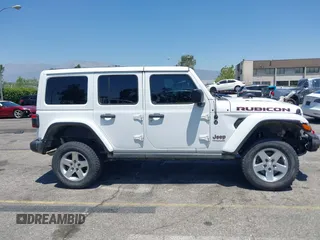 2018 Jeep Wrangler Unlimited Rubicon with VIN 1C4HJXFN8JW215023, listed as a IAAI auction lot 42227099 with 62,195 mi miles and . Bid and sale history available at DreamBid. Image 13.
