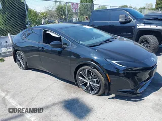 2024 Toyota Prius LE z VIN JTDACAAU1R3046628, wystawiony jako IAAI lot #41841832 z przebiegiem 1 238 mil mil oraz . Historia ofert i sprzedaży dostępna na DreamBid. Obrazek 1.