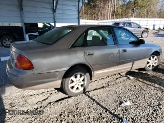 2000 Toyota Avalon XL z VIN 4T1BF28B2YU079163, wystawiony jako Copart lot #50129935 z przebiegiem 311 916 mil mil oraz Nie do naprawy • Non repairable. Historia ofert i sprzedaży dostępna na DreamBid. Obrazek 3.