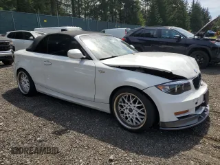 2010 BMW 1 Series 128i with VIN WBAUN1C50AVH81851, listed as a Copart auction lot 56607275 with 145,036 mi miles and Salvage title. Bid and sale history available at DreamBid. Image 4.