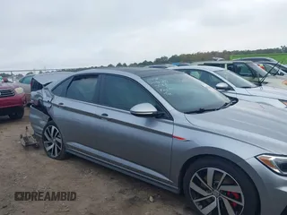 2019 Volkswagen Jetta GLI S z VIN 3VW5T7BU4KM165083, wystawiony jako IAAI lot #40729763 z przebiegiem 75 414 mil mil oraz . Historia ofert i sprzedaży dostępna na DreamBid. Obrazek 13.