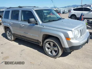 2014 Jeep Patriot Latitude with VIN 1C4NJRFB5ED623906, listed as a IAAI auction lot 42134013 with 202,859 mi miles and . Bid and sale history available at carsss.com. Image 1.