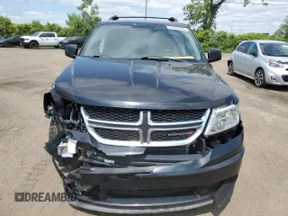 2013 Dodge Journey SE with VIN 3C4PDCAB0DT500365, listed as a Copart auction lot 61033665 with 193,231 mi miles and Salvage title. Bid and sale history available at DreamBid. Image 5.
