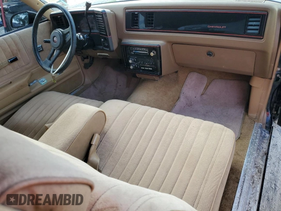 1987 Chevrolet Monte Carlo z VIN 1G1GZ11G0HP115148, wystawiony jako Copart lot #75645874 z przebiegiem 86 744 mil mil oraz Nie do naprawy. Historia ofert i sprzedaży dostępna na DreamBid. Obrazek 8.