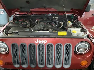 2007 Jeep Wrangler Unlimited Sahara with VIN 1J4GA59197L104784, listed as a Copart auction lot 56700205 with 156,382 mi miles and Salvage title. Bid and sale history available at DreamBid. Image 12.