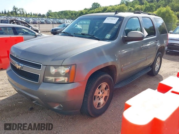 2007 Chevrolet Tahoe LS z VIN 1GNFC13027R231885, wystawiony jako IAAI lot #42750247 z przebiegiem 167 072 mil mil oraz . Historia ofert i sprzedaży dostępna na DreamBid. Obrazek 2.