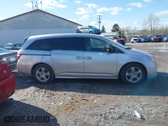 2011 Honda Odyssey Touring with VIN 5FNRL5H92BB049901, listed as a IAAI auction lot 41985224 with 101,957 mi miles and . Bid and sale history available at DreamBid. Image 13.